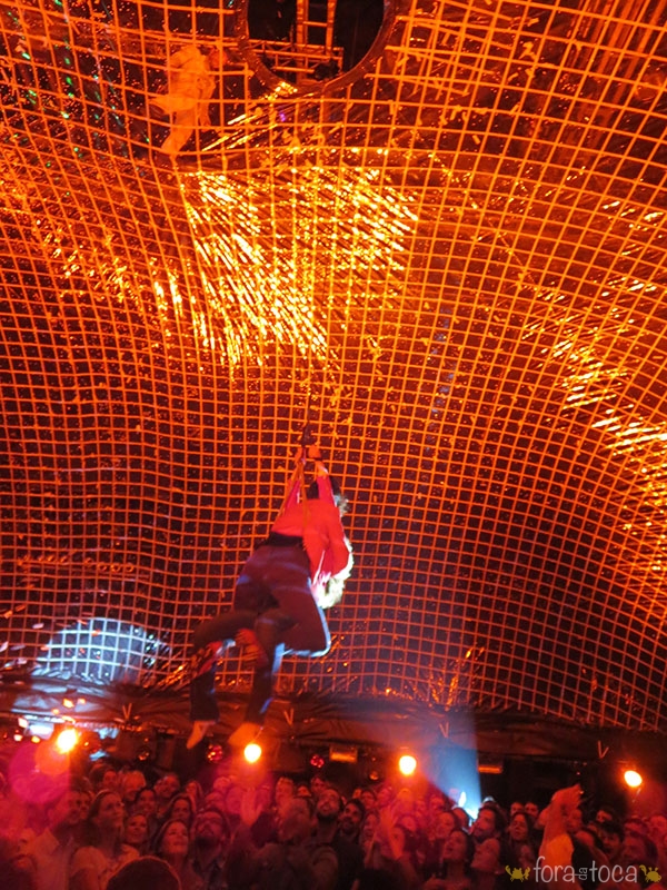 one of the actresses comes down with a cable through a hole in the plastic bubble and carries one of the spectators to climb